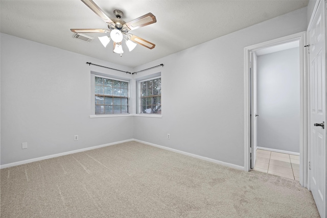 10255 Crooks Way Ct, Houston, TX 77065 - empty room with light carpet, a ceiling fan, and baseboards