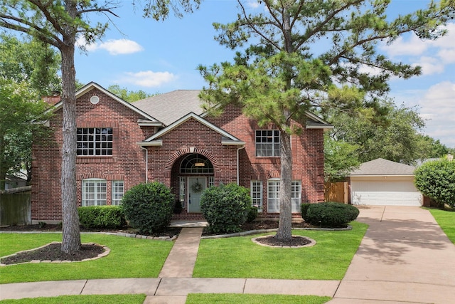 10255 Crooks Way Ct, Houston, TX 77065 - traditional-style home with brick siding, a front yard, driveway, and an outbuilding