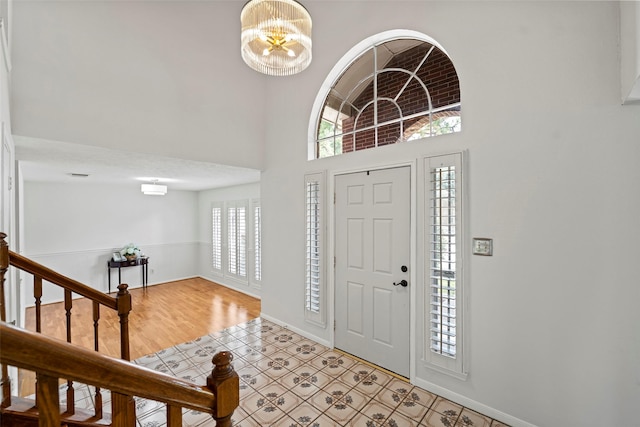 10255 Crooks Way Ct, Houston, TX 77065 - foyer entrance with a chandelier, baseboards, a high ceiling, and stairs