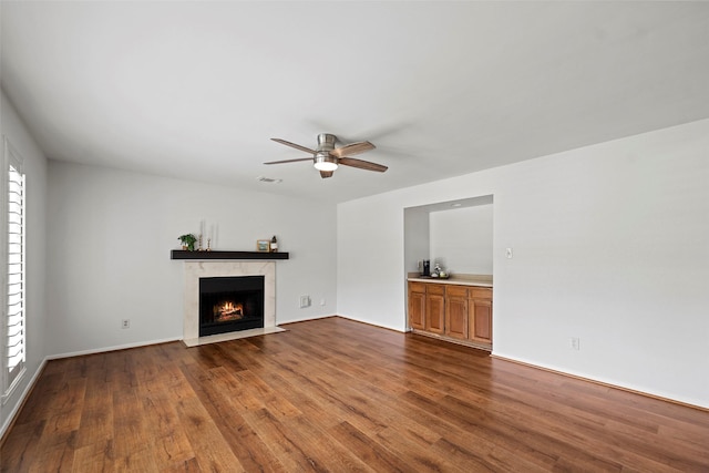 10255 Crooks Way Ct, Houston, TX 77065 - unfurnished living room featuring dark wood finished floors, a ceiling fan, a premium fireplace, and baseboards