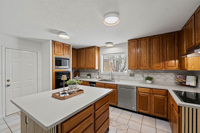 10255 Crooks Way Ct, Houston, TX 77065 - kitchen with black appliances, a sink, light tile patterned floors, backsplash, and light countertops
