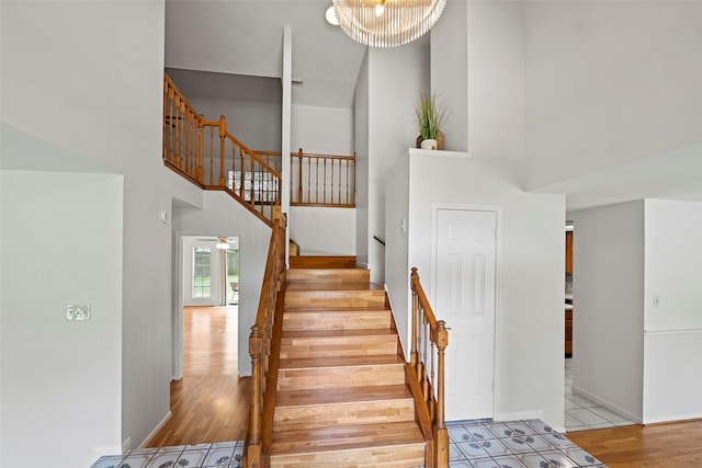 10255 Crooks Way Ct, Houston, TX 77065 - stairs with a high ceiling, wood finished floors, and baseboards