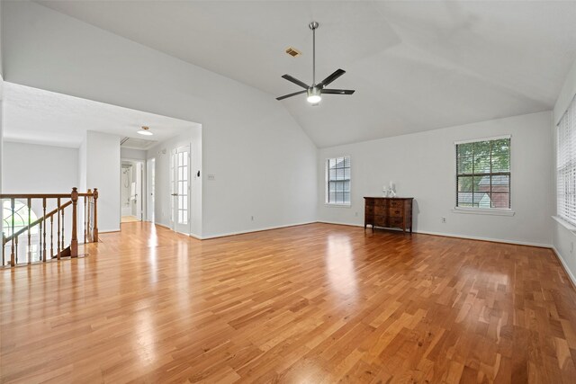 10255 Crooks Way Ct, Houston, TX 77065 - unfurnished living room with light wood-type flooring, plenty of natural light, ceiling fan, high vaulted ceiling, and baseboards