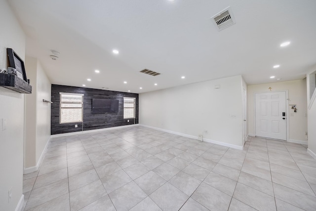19314 Cactus Thorn Dr, Cypress, TX 77433 - unfurnished living room featuring recessed lighting, light tile patterned flooring, baseboards, and an accent wall
