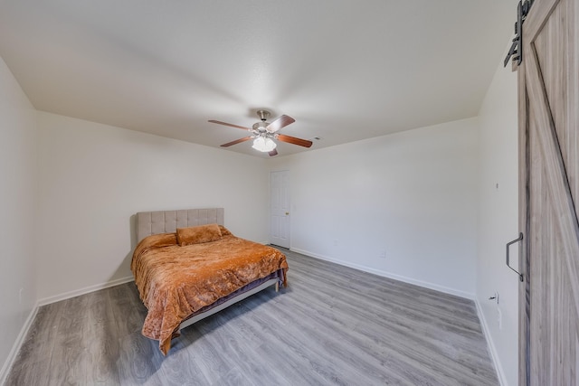 19314 Cactus Thorn Dr, Cypress, TX 77433 - bedroom featuring wood finished floors, baseboards, and ceiling fan