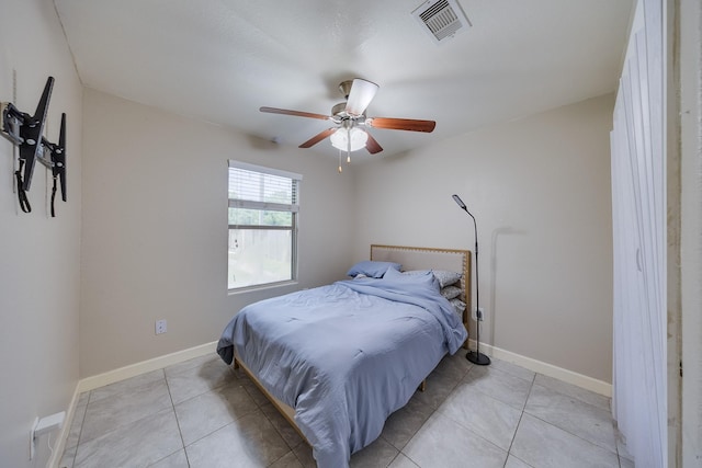 19314 Cactus Thorn Dr, Cypress, TX 77433 - bedroom featuring light tile patterned floors, a ceiling fan, and baseboards