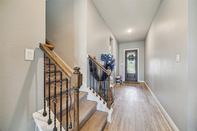 12402 Oakleaf Bend Dr, Humble, TX 77346 - entrance foyer featuring wood finished floors, a textured wall, baseboards, and stairway