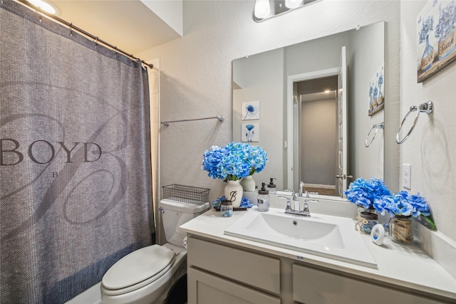 12402 Oakleaf Bend Dr, Humble, TX 77346 - full bathroom with toilet, vanity, a textured wall, and shower / tub combo