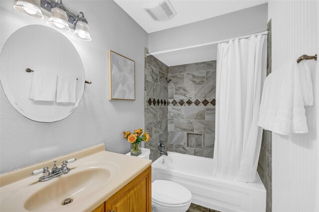 3220 69th St Unit K6, Galveston, TX 77551 - bathroom with shower / tub combo with curtain, toilet, vanity, and a textured wall