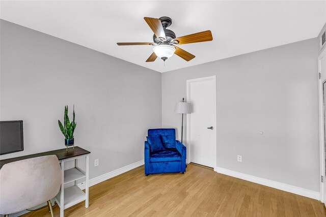 3220 69th St Unit K6, Galveston, TX 77551 - living area with baseboards, ceiling fan, and wood finished floors