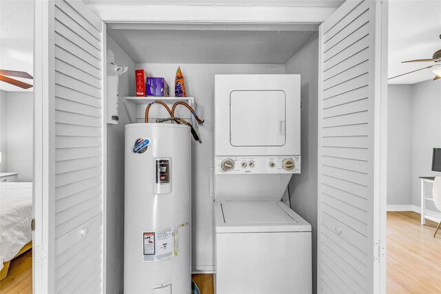 3220 69th St Unit K6, Galveston, TX 77551 - laundry area with water heater, estacked washer and dryer, a ceiling fan, and light wood-style floors