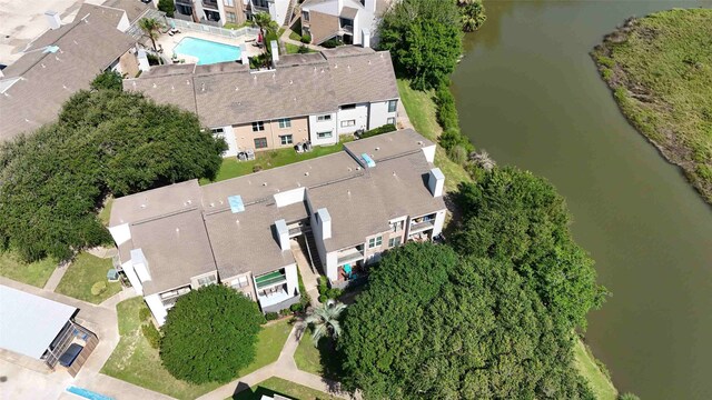 3220 69th St Unit K6, Galveston, TX 77551 - aerial overview of property's location featuring a pool area, a large body of water, and nearby suburban area