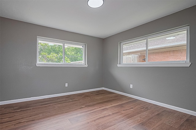 11903 Atwell Dr, Houston, TX 77035 - empty room with wood finished floors and baseboards