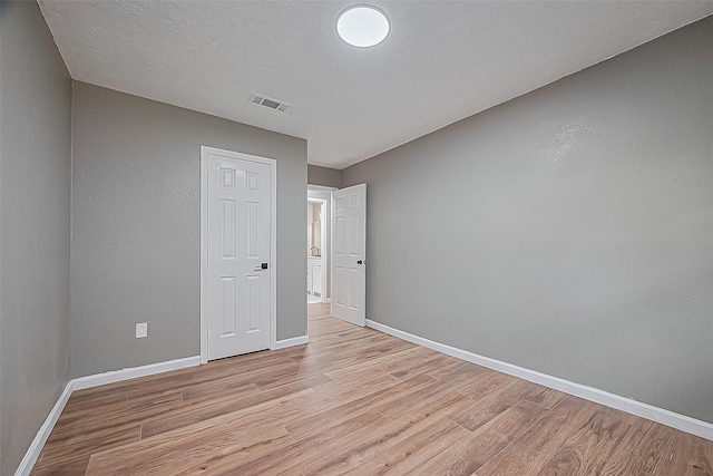 11903 Atwell Dr, Houston, TX 77035 - unfurnished bedroom with light wood finished floors and baseboards