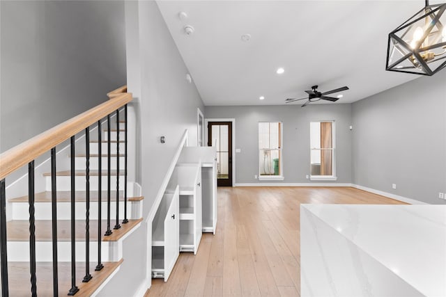 1412 Weiss St, Houston, TX 77009 - staircase with hardwood / wood-style floors, ceiling fan, recessed lighting, and baseboards