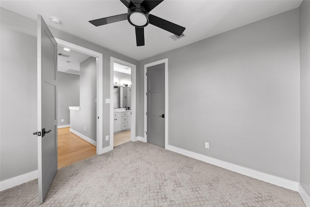 1412 Weiss St, Houston, TX 77009 - unfurnished bedroom featuring baseboards, light carpet, ensuite bath, and ceiling fan