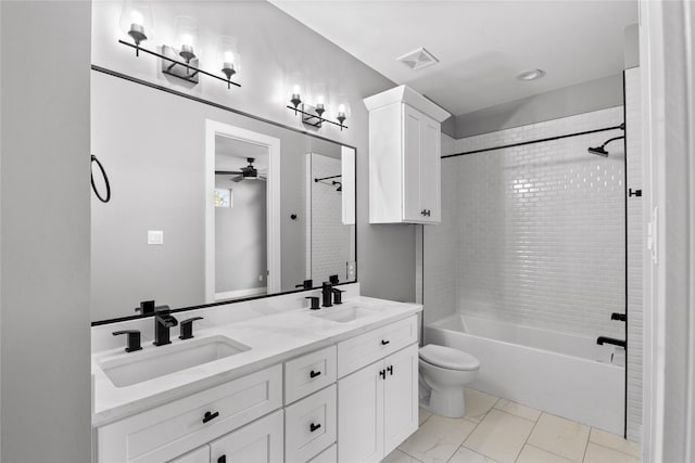 1412 Weiss St, Houston, TX 77009 - full bath with toilet, a ceiling fan, double vanity,  shower combination, and marble finish flooring