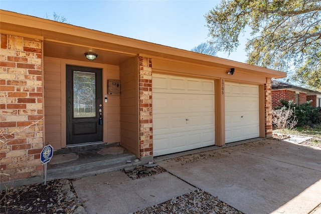 1705 Bimini Way, Seabrook, TX 77586 - property entrance with brick siding, an attached garage, and driveway