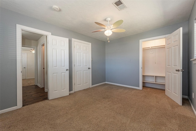1705 Bimini Way, Seabrook, TX 77586 - unfurnished bedroom featuring carpet flooring, baseboards, ceiling fan, and a closet