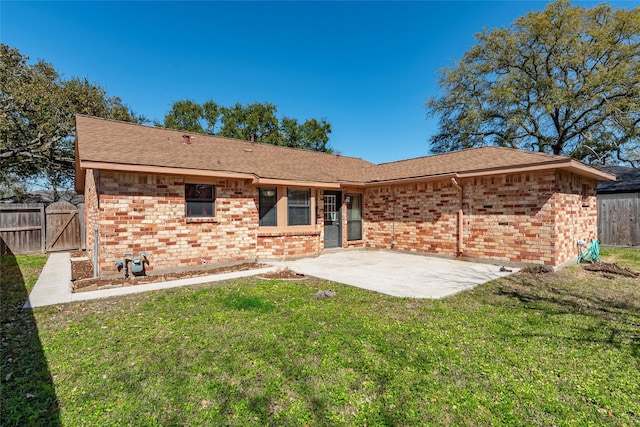 1705 Bimini Way, Seabrook, TX 77586 - rear view of house featuring a gate, brick siding, a patio, and a shingled roof