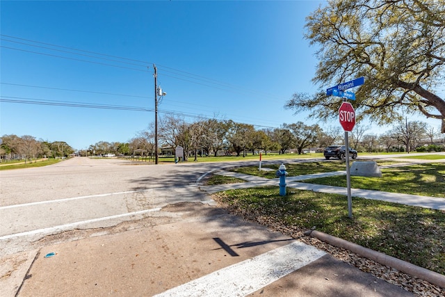 1705 Bimini Way, Seabrook, TX 77586 - view of asphalt road featuring traffic signs