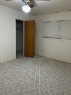 5005 Oak Ln, Texas City, TX 77591 - unfurnished bedroom with a closet, light colored carpet, and a ceiling fan
