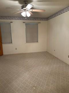 5005 Oak Ln, Texas City, TX 77591 - carpeted empty room featuring a ceiling fan