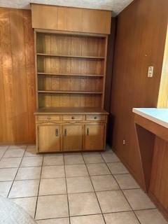 5005 Oak Ln, Texas City, TX 77591 - interior space featuring light tile patterned floors and wooden walls