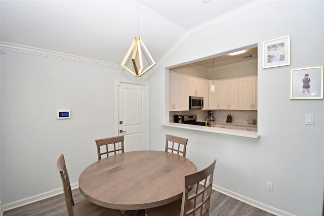 1202 Fort St, Richmond, TX 77469 - dining room featuring dark wood-style floors, crown molding, baseboards, and lofted ceiling