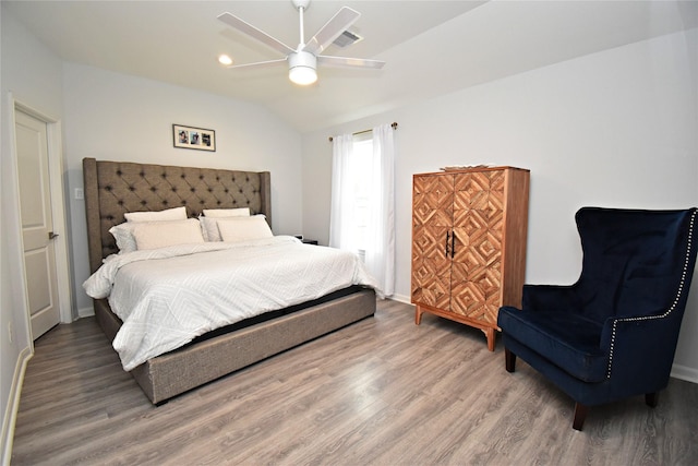 1202 Fort St, Richmond, TX 77469 - bedroom featuring wood finished floors, lofted ceiling, ceiling fan, and baseboards