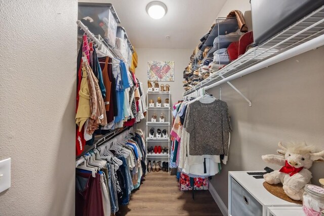 3231 Allen Pkwy Unit 6106, Houston, TX 77019 - walk in closet featuring wood finished floors