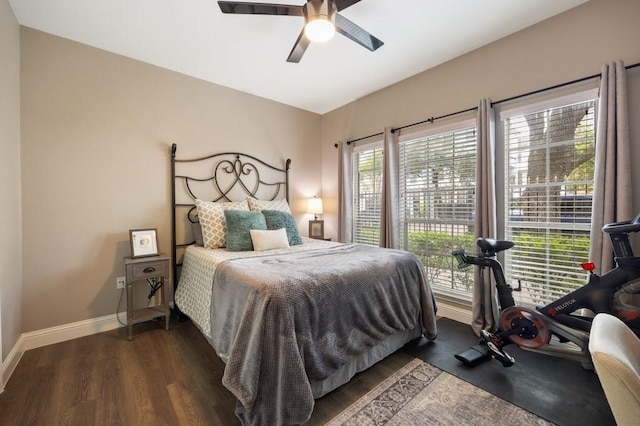 3231 Allen Pkwy Unit 6106, Houston, TX 77019 - bedroom featuring baseboards, dark wood-type flooring, and a ceiling fan
