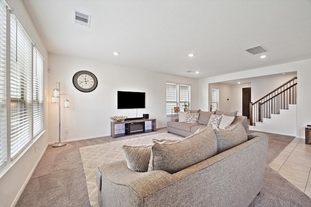 17303 Rock Willow Ln, Tomball, TX 77377 - tiled living room with stairway, recessed lighting, baseboards, and carpet flooring