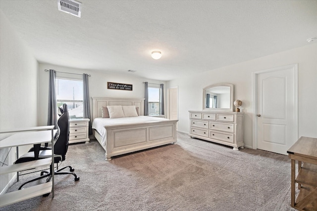 17303 Rock Willow Ln, Tomball, TX 77377 - bedroom featuring carpet floors, a desk, and a textured ceiling