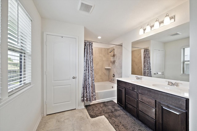17303 Rock Willow Ln, Tomball, TX 77377 - bathroom with double vanity, shower / tub combo with curtain, baseboards, and tile patterned flooring