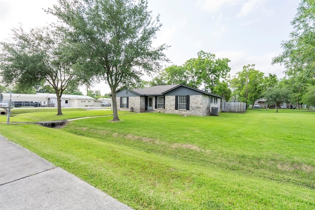 4801 36th St, Dickinson, TX 77539 - ranch-style home with a front yard and brick siding