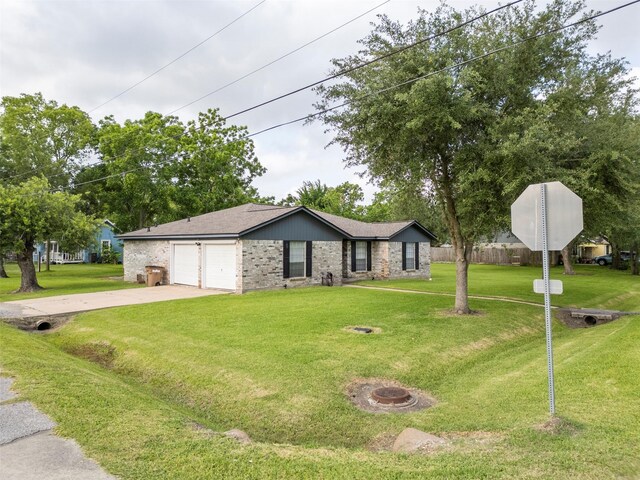 4801 36th St, Dickinson, TX 77539 - view of front facade with driveway and an attached garage