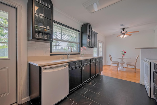 3042 Oak Forest Dr, Houston, TX 77018 - kitchen with white dishwasher, a sink, ornamental molding, light countertops, and decorative backsplash