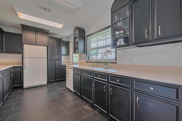 3042 Oak Forest Dr, Houston, TX 77018 - kitchen with white appliances, a sink, crown molding, glass insert cabinets, and decorative backsplash