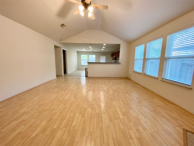 9414 Glendown Ln, Houston, TX 77070 - unfurnished living room featuring a ceiling fan, light wood-type flooring, and lofted ceiling