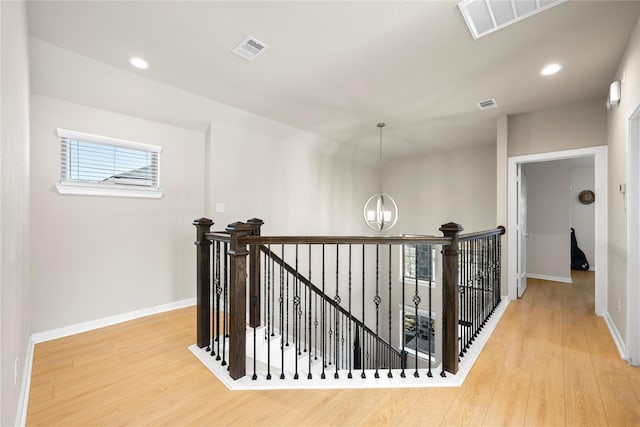 17814 Tree Of Heaven, Conroe, TX 77385 - hallway featuring an upstairs landing, a chandelier, wood finished floors, baseboards, and recessed lighting