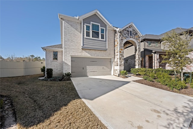17814 Tree Of Heaven, Conroe, TX 77385 - view of front facade featuring concrete driveway, an attached garage, fence, and brick siding