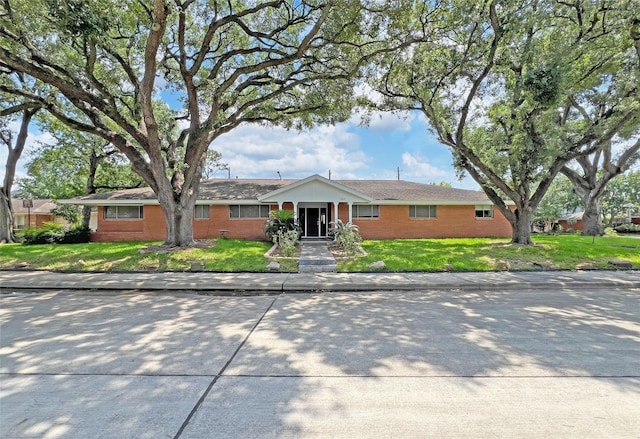 3641 Deal St, Houston, TX 77025 - single story home featuring brick siding and a front yard