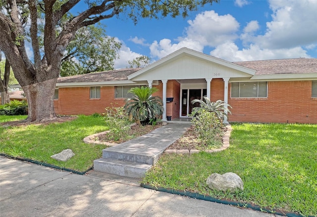 3641 Deal St, Houston, TX 77025 - ranch-style house with brick siding, a front yard, and roof with shingles