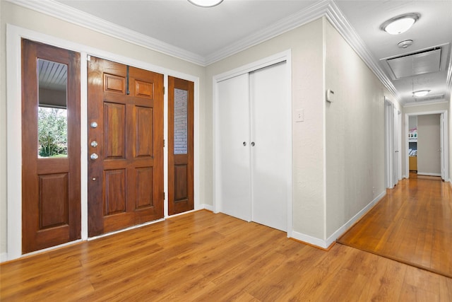 3641 Deal St, Houston, TX 77025 - foyer entrance featuring light wood-style floors, crown molding, and baseboards