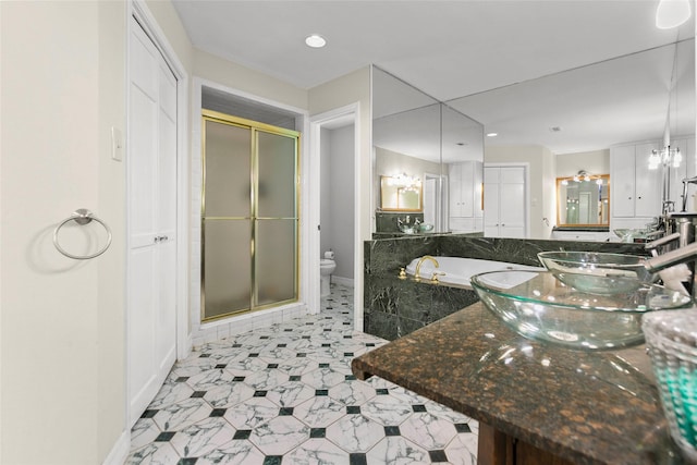 3641 Deal St, Houston, TX 77025 - bathroom featuring a stall shower, baseboards, toilet, a garden tub, and recessed lighting