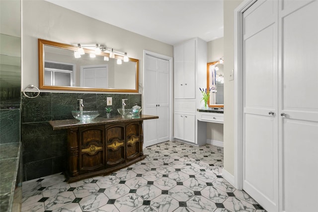 3641 Deal St, Houston, TX 77025 - full bathroom with tile patterned floors, decorative backsplash, vanity, and baseboards