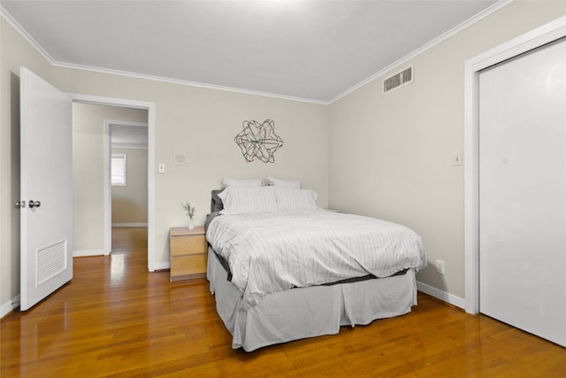 3641 Deal St, Houston, TX 77025 - bedroom with crown molding, wood finished floors, and baseboards