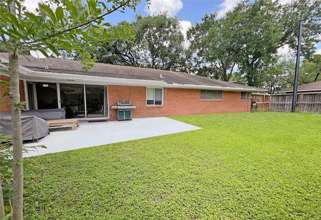 3641 Deal St, Houston, TX 77025 - rear view of house featuring a patio, brick siding, and a shingled roof