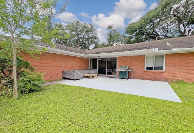 3641 Deal St, Houston, TX 77025 - back of house with a patio area, brick siding, and a lawn